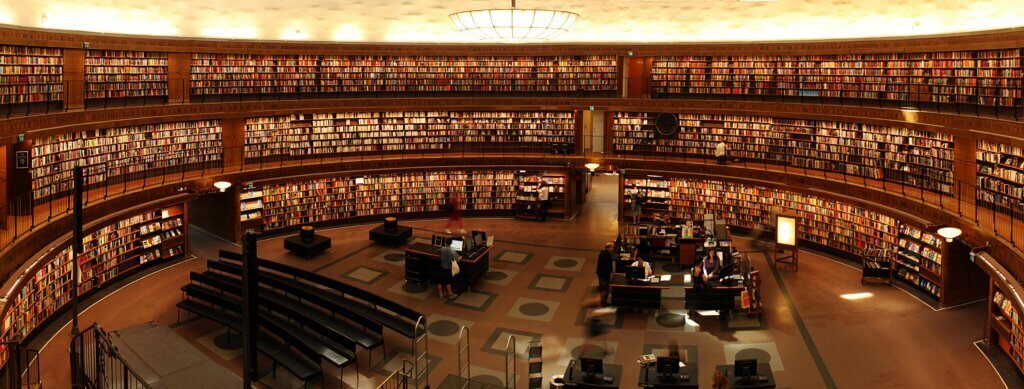 A quiet night studying at a large library.